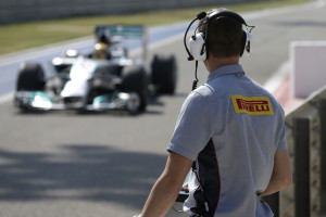 A Pirelli technician watches the track action