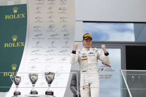 2015 GP2 Series Round 4.  Red Bull Ring, Spielberg, Austria.  Saturday 20 June 2015.  Stoffel Vandoorne (BEL, ART Grand Prix) celebrates his win on the podium. Photo: Sam Bloxham/GP2 Media Service  ref: Digital Image _G7C5298