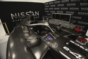 Image of the Nissan's GEN4 Formula E car in the workshop with no wheels or livery